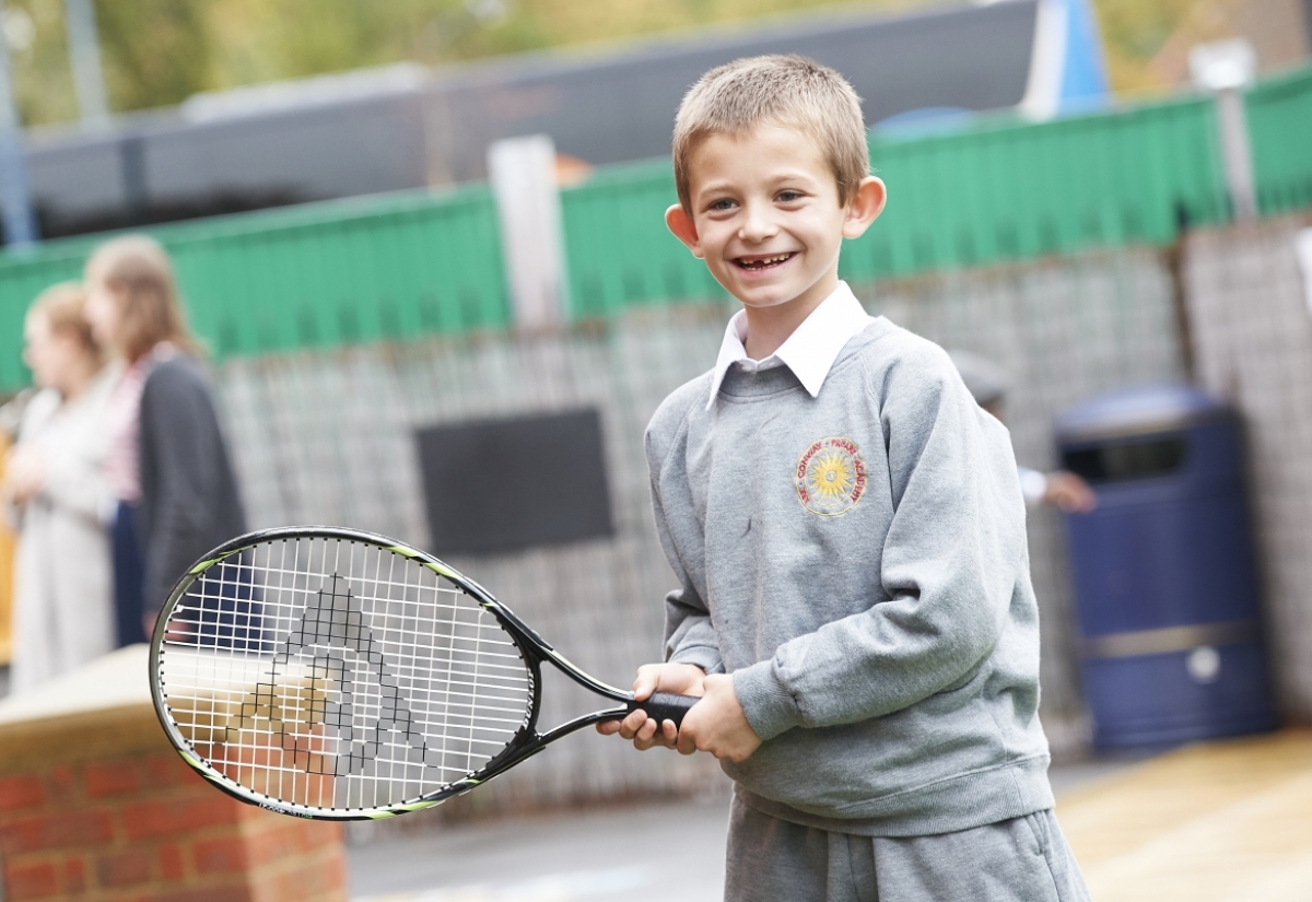 boy playing tennis
